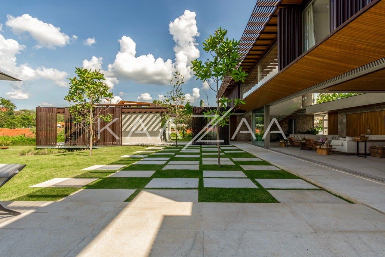 Casa contemporânea feita para interagir com a natureza ao redor. Projeto na Quinta da Baroneza. - Foto 5