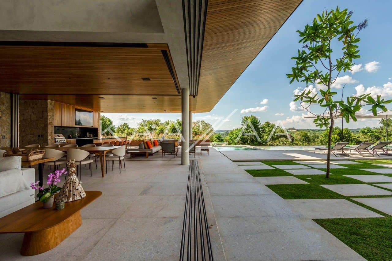 Casa contemporânea feita para interagir com a natureza ao redor. Projeto na Quinta da Baroneza. - Foto 8