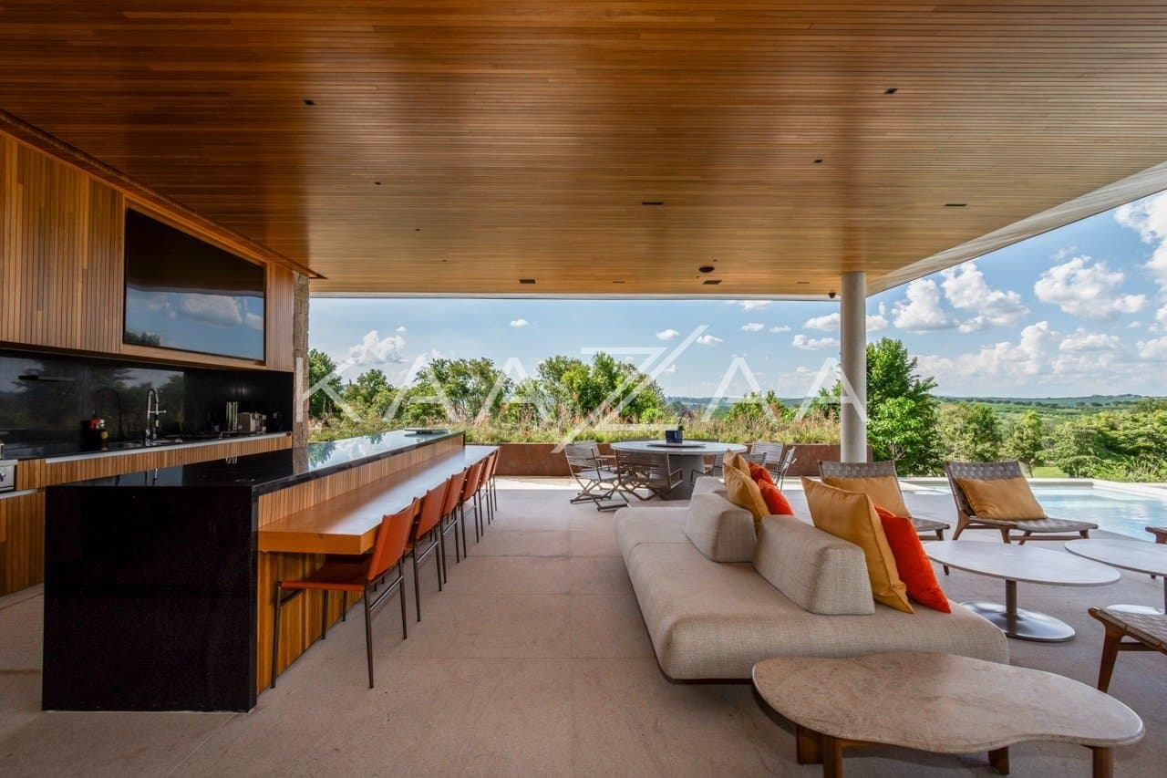 Casa contemporânea feita para interagir com a natureza ao redor. Projeto na Quinta da Baroneza. - Foto 10