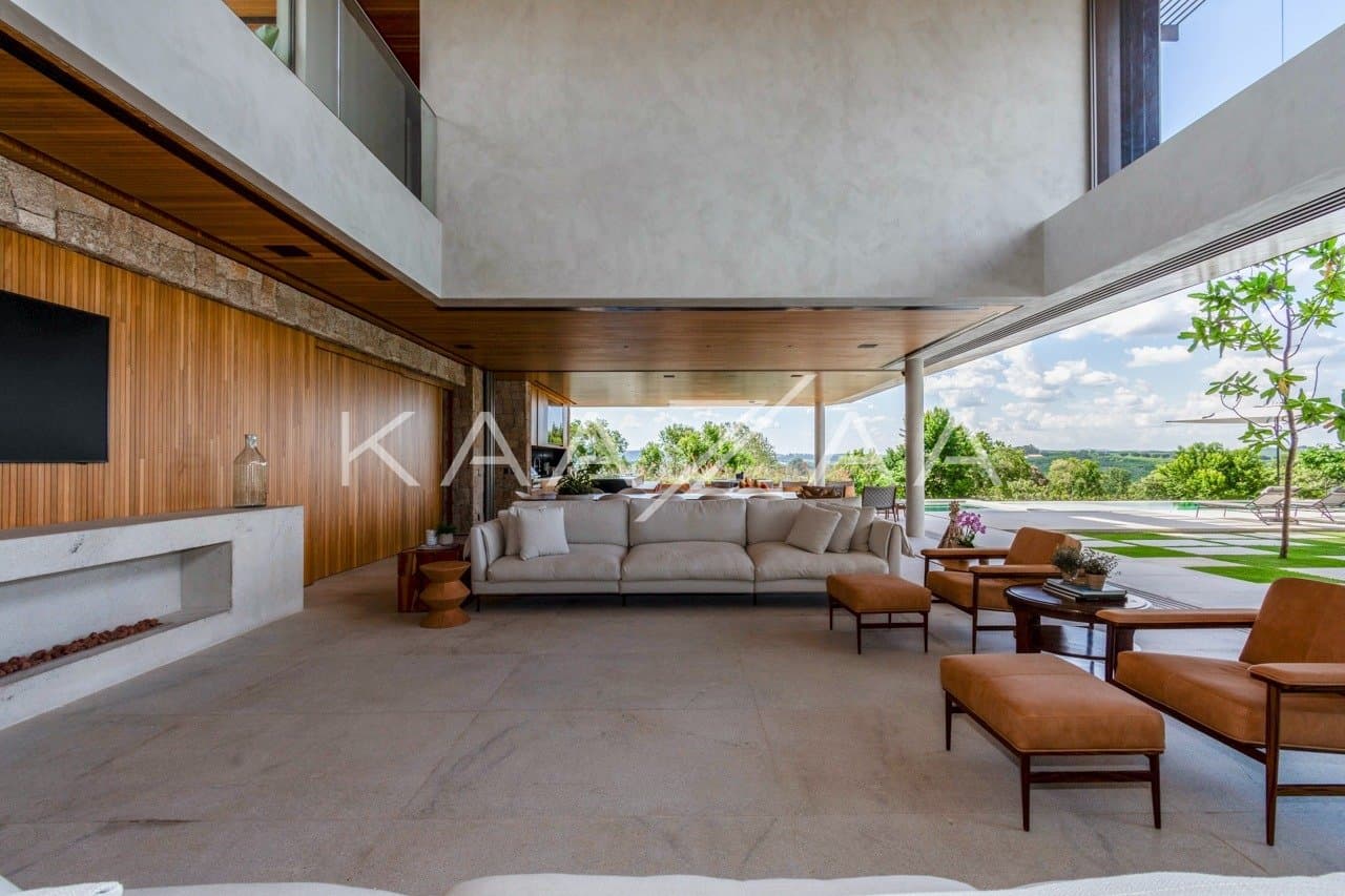 Casa contemporânea feita para interagir com a natureza ao redor. Projeto na Quinta da Baroneza. - Foto 14